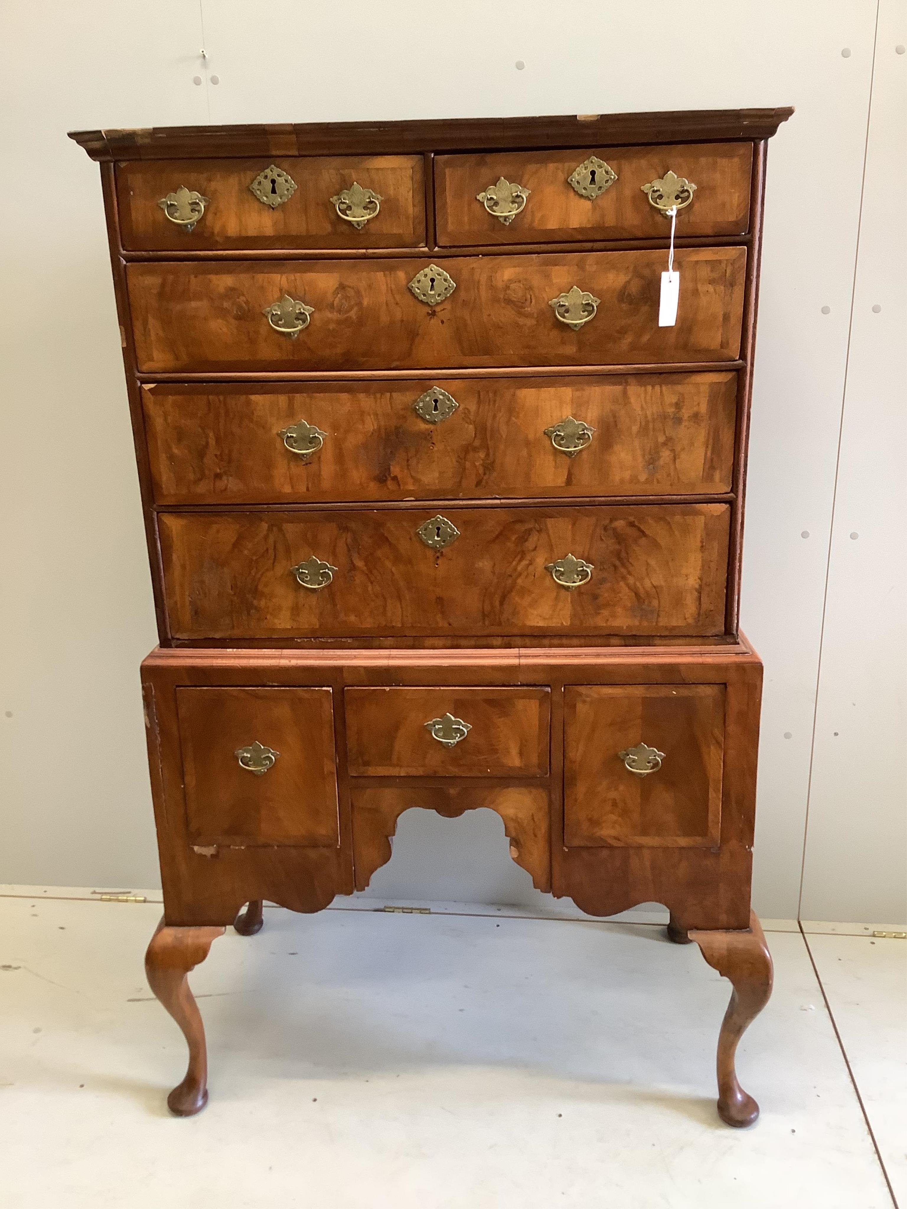 An 18th century and later walnut chest on stand, width 96cm, depth 55cm, height 161cm. Condition - fair